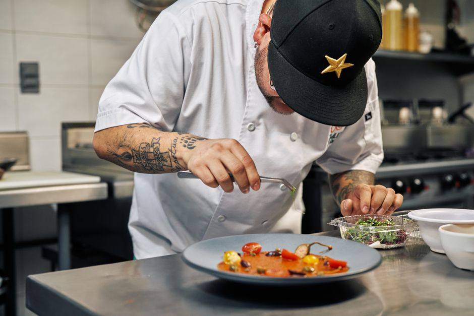 Chef meticulously plating gourmet food